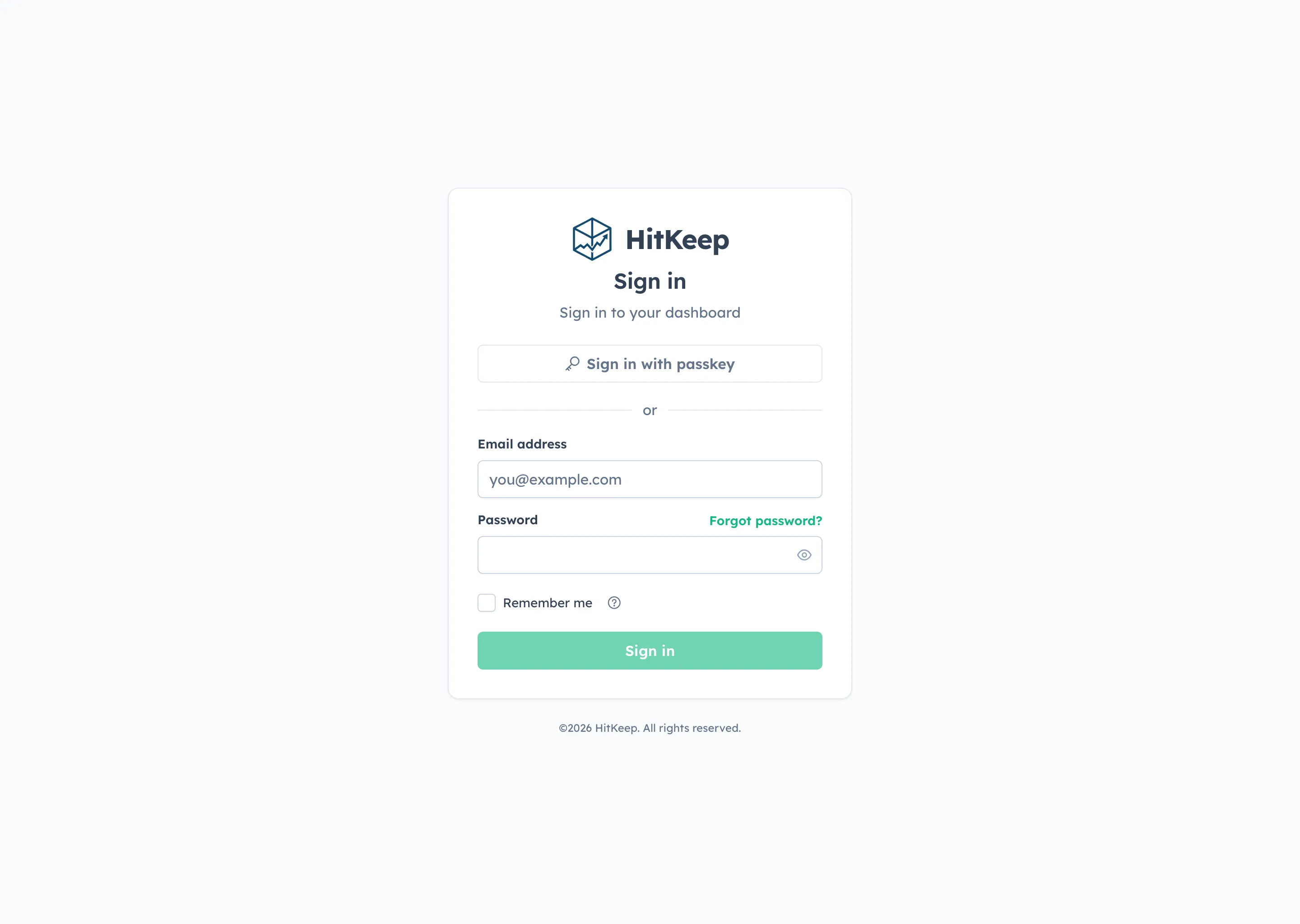 HitKeep login page with password sign-in and passkey sign-in options