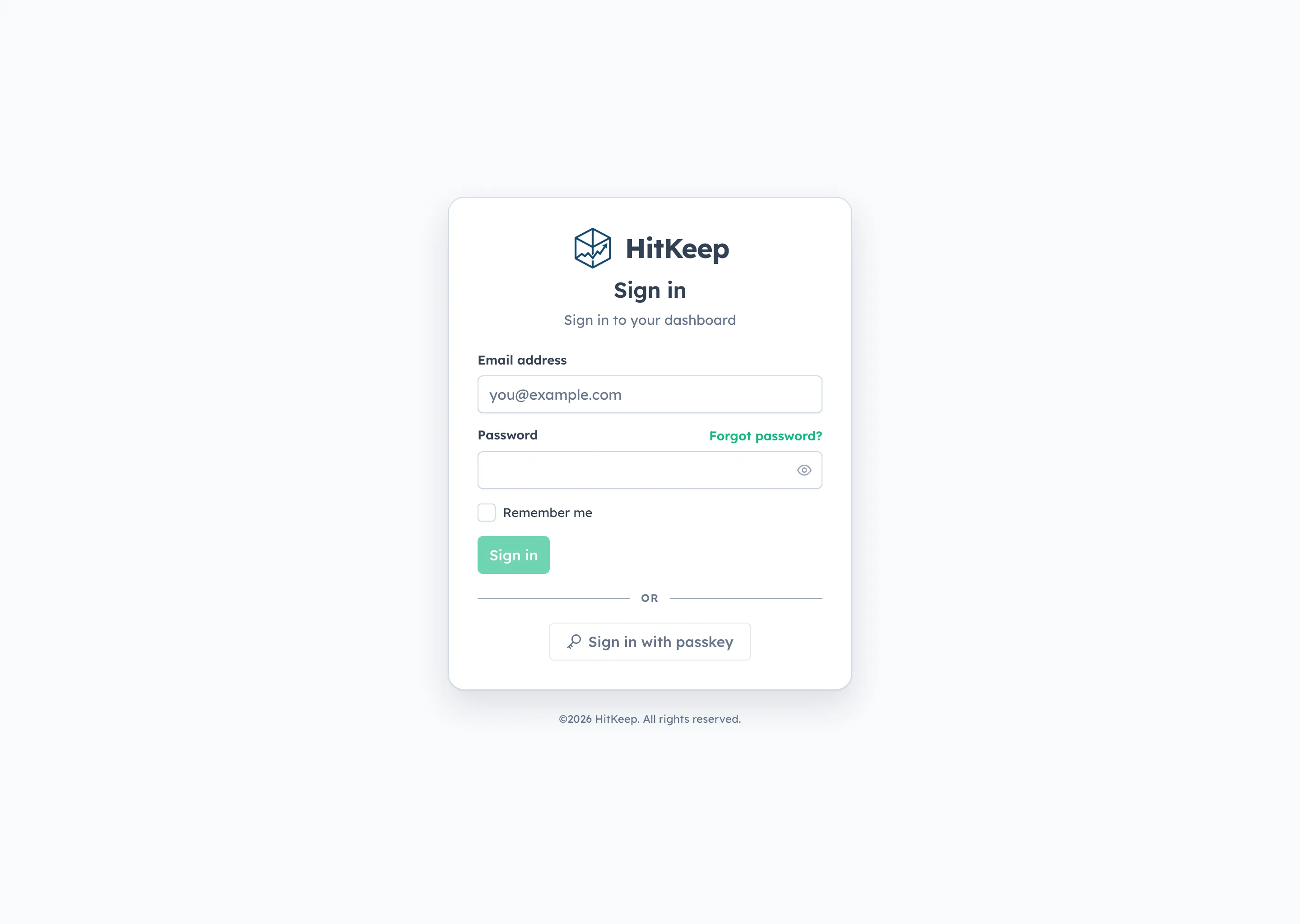 HitKeep login page with password sign-in and passkey sign-in options