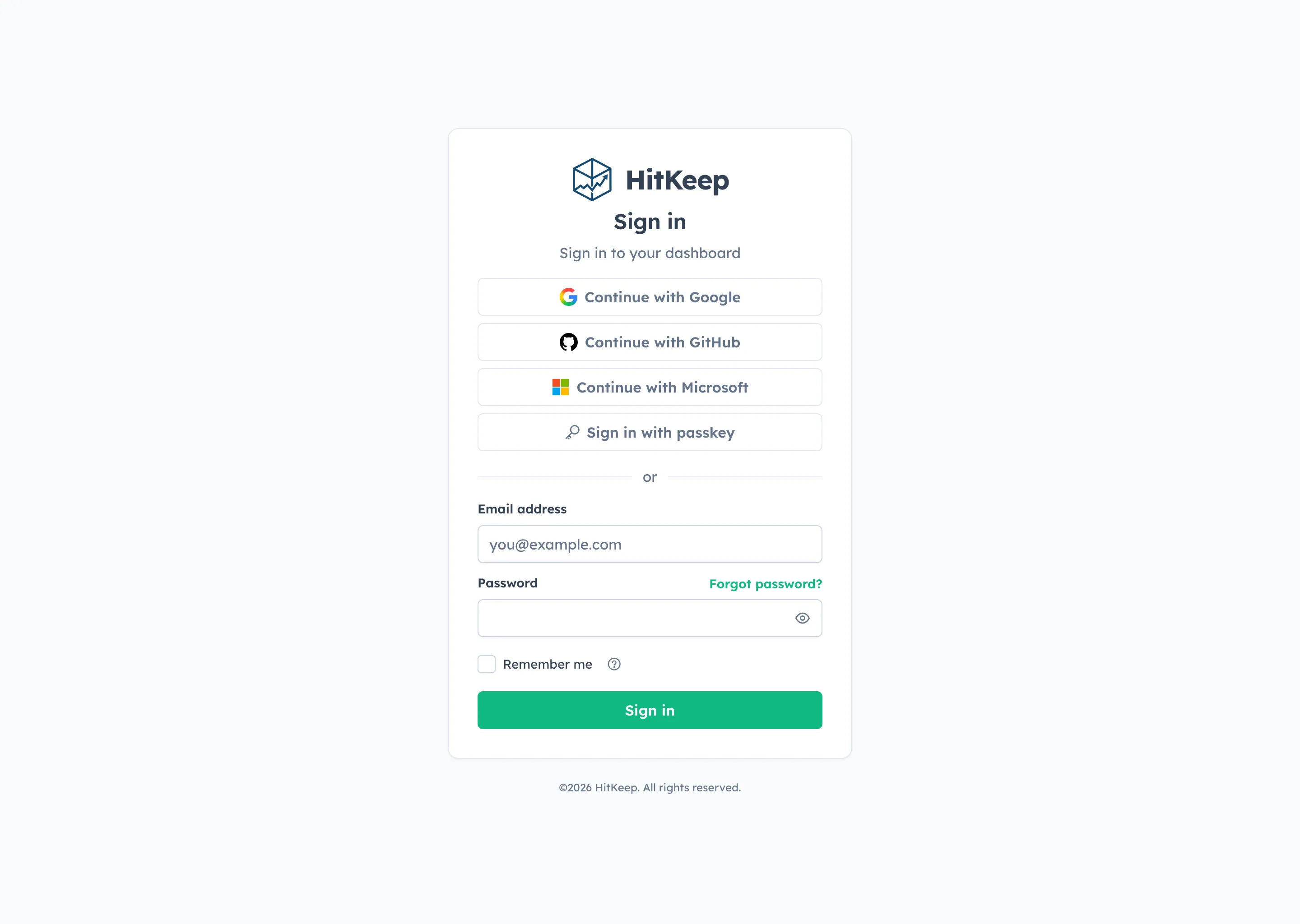 HitKeep login page with password sign-in and passkey sign-in options